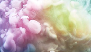 Swirling colorful smoke, sky clouds of pastel colors, meditative relaxing esoteric vibrant backdrop. Rainbow iridescent fog background